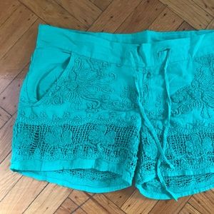 Green embroidered shorts